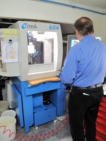 This is Paul standing in front of his new CNC machine - he uses this to make parts of all the watches - but also to make his own movement and even his own escapement.