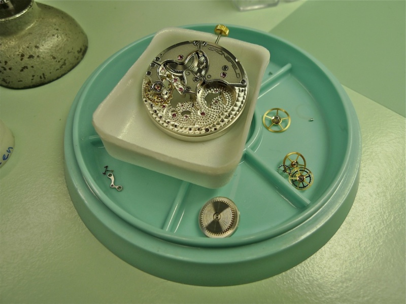 Partially assembled movement with the parts ready to go in