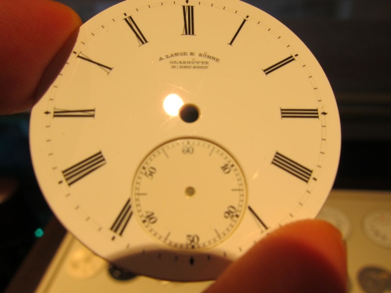 An enamel dial of a pocket watch