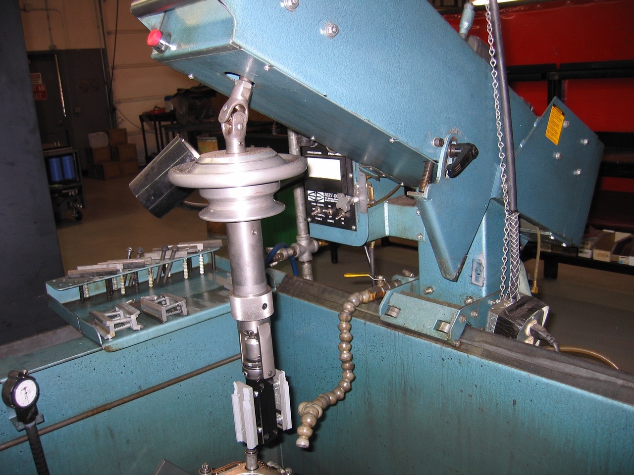 It kind of reminds me of a CNC machine for watches, just a giant version that drills more than baseplates.