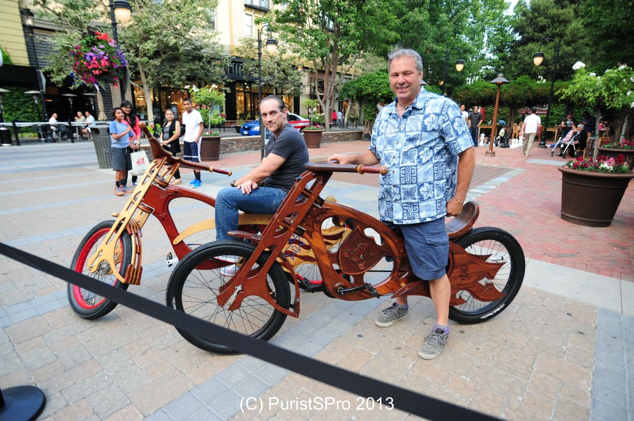 Local artist shows off his nice wheels alongside the Rolls-Royce event. These are wooden bicycles.
