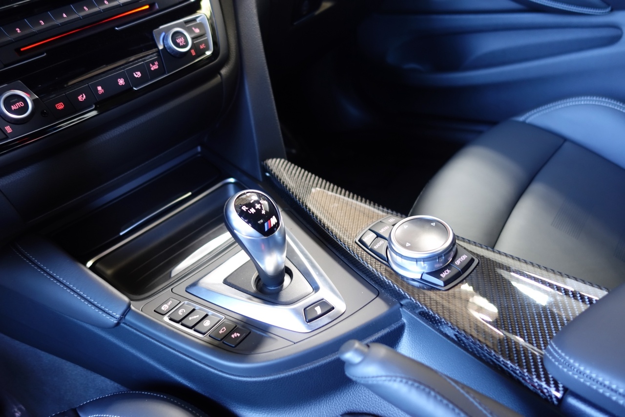 Carbon Fiber trim and responsiveness settings for the engine, suspension, and steering. The iDrive now has a touchscreen where you can draw letters.