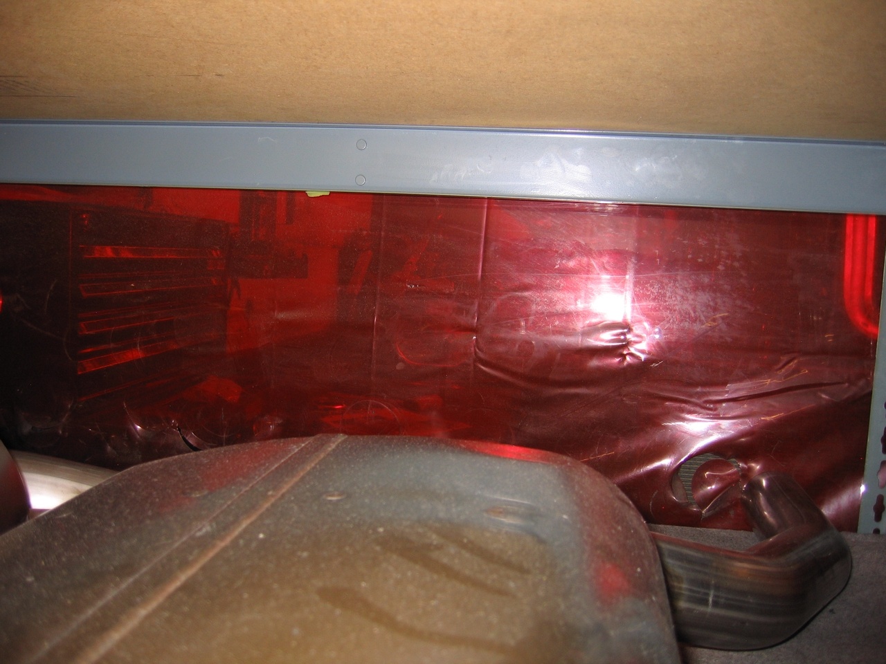 Behind the red tarp, is where they weld the exhaust parts. 