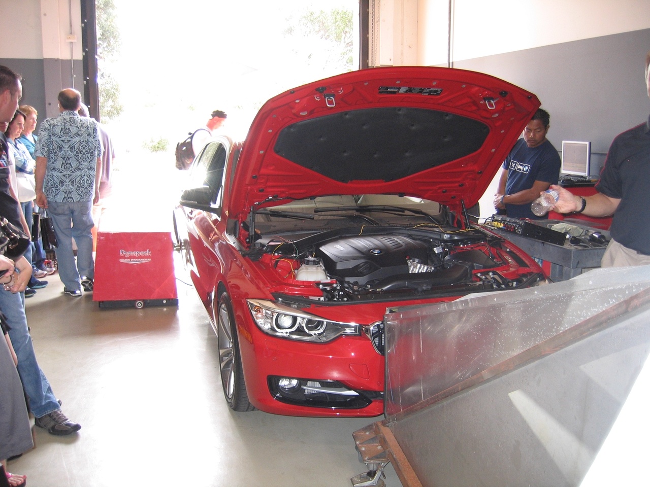 This is a dyno. It measures at the wheels, how much power the car produces. 