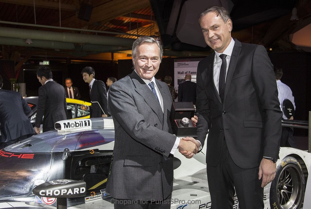 Karl Friedrich Scheufele offering a Superfast Chrono Porsche 919 Edition to Dr Oliver Blume, Chairman of the board Porsche AG