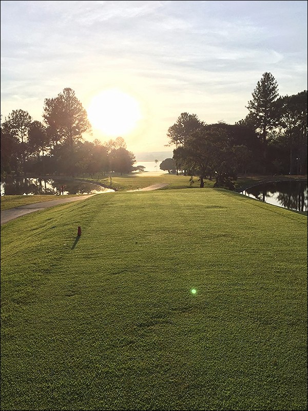 Watching the sunrise while playing a par 5.