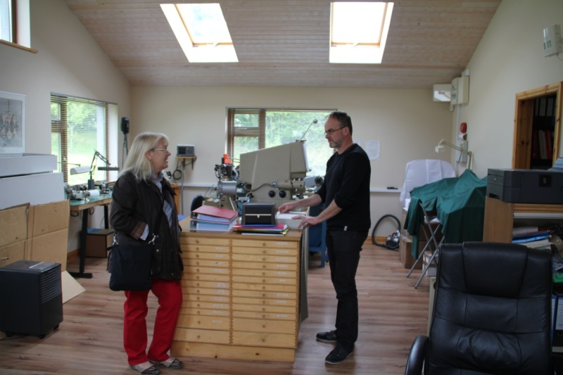 inside a watchmaker by the name of John McGonigle talks with Linda about watches. Yes she is really interested. 