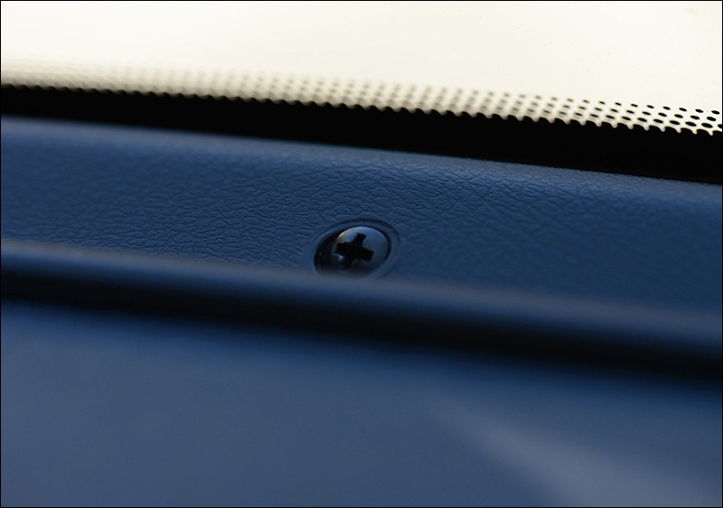Actual, robust screw holds the dash at the window line