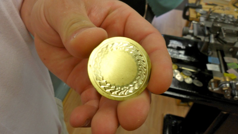 Roland showing result on brass of his demonstration