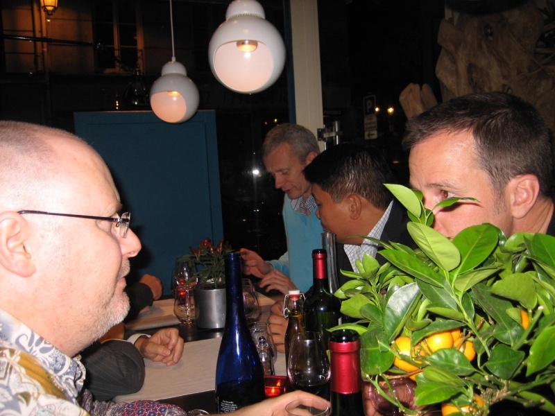 Oliver hiding behind an orange tree..