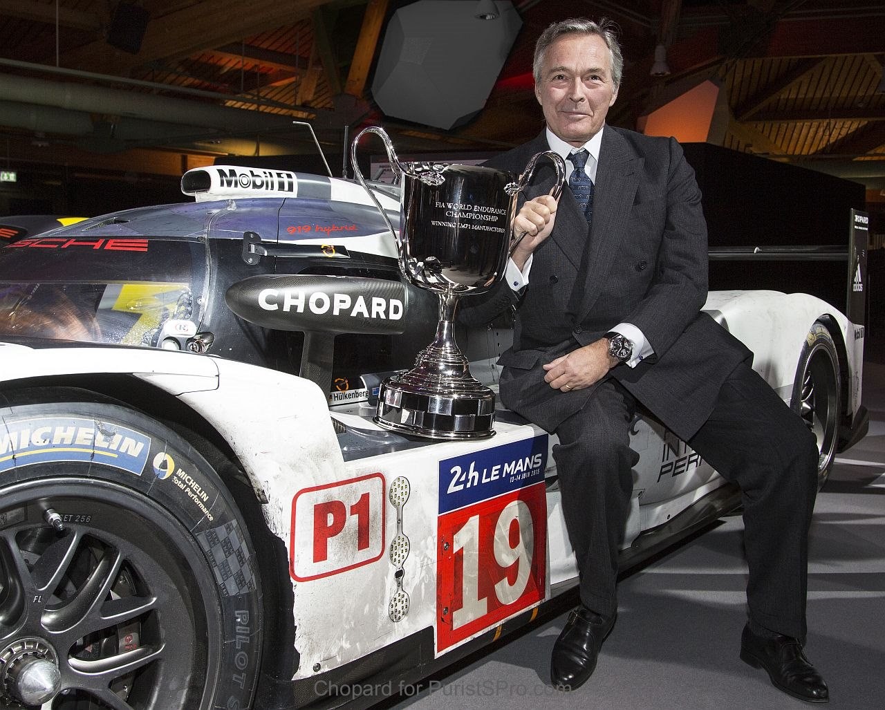 Karl-Friedrich Scheufele holding the FIA WEC Champion cup on the Le Mans winning Porsche 919 Hybrid