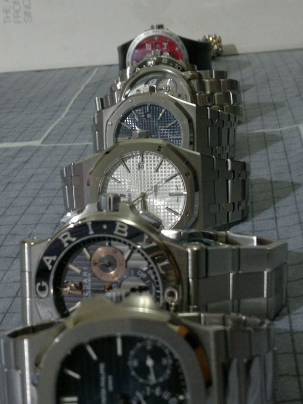from near to far: Patek Philippe Nautilus Moonphase, Bvlgari Diagono Calibro 303, Audemars Piguet Royal Oak in white, Audemars Piguet Royal Oak in blue, Mont Blanc Nicolas Rieussec Automatic MB R200, Rolex GMT Master II, Porsche Design P6000, Rolex Datejust