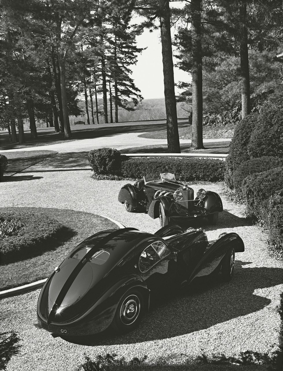 Vintage cars on Ralph Lauren's driveway