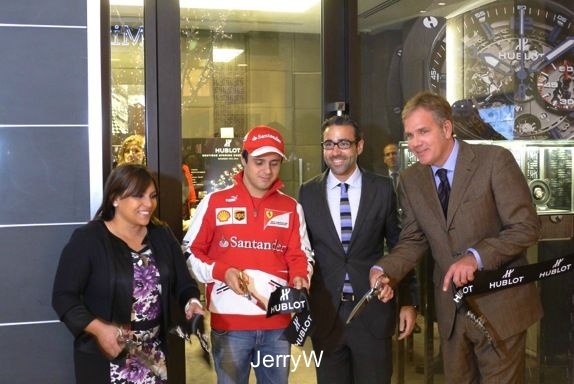 Felipe Massa cutting the grand opening ribbon.