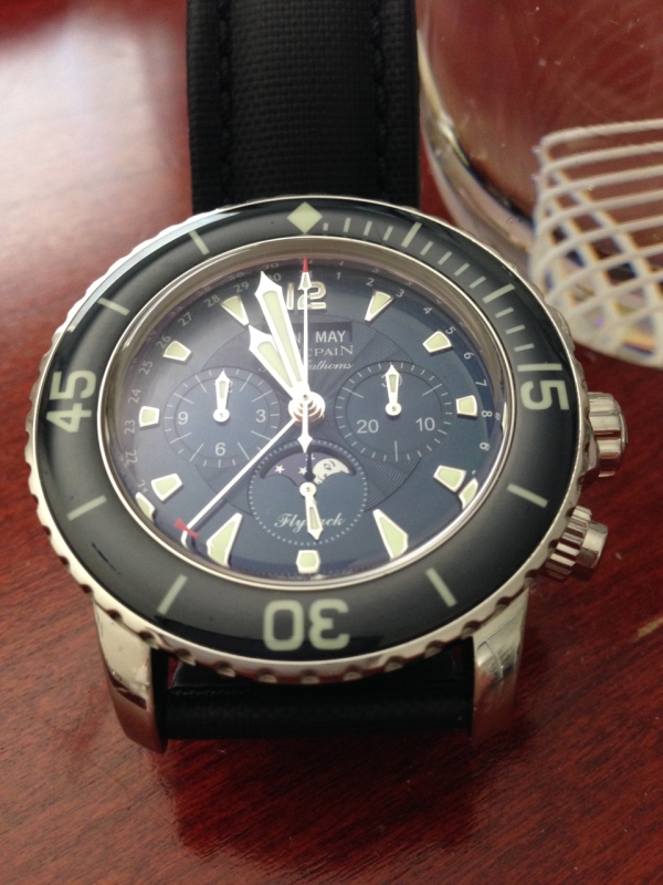 Here is the best I can do with iPhone and no flash; any marks you see on the bezel, etc. are artifacts of the photo