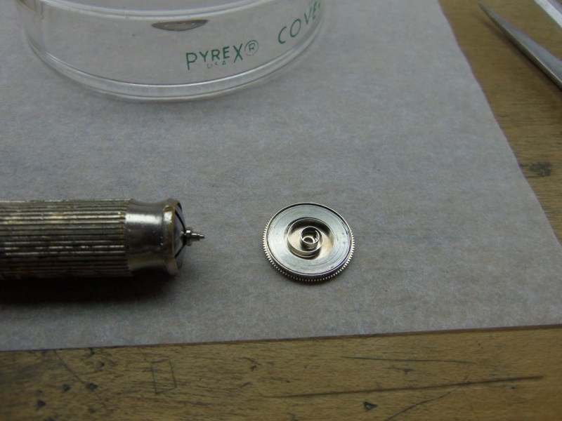 Mainspring barrel and arbor.