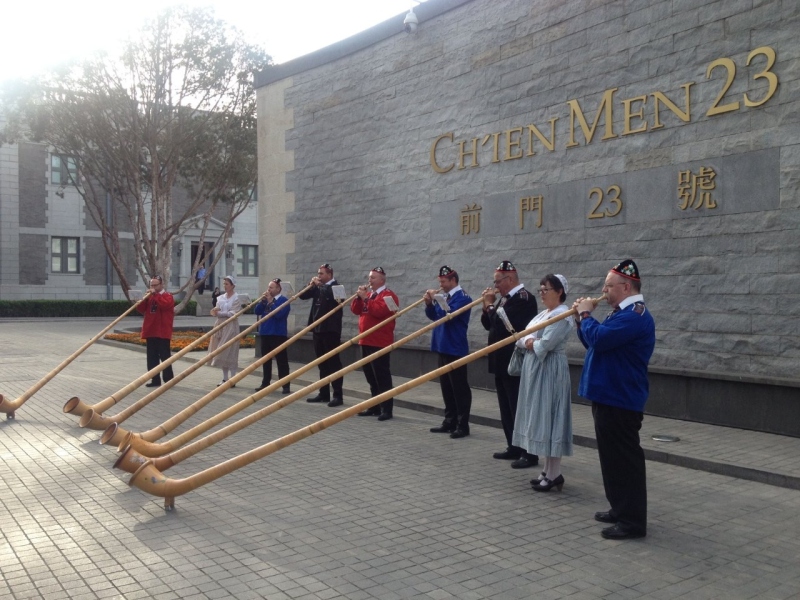 greeted by Swiss Alphorns before entering