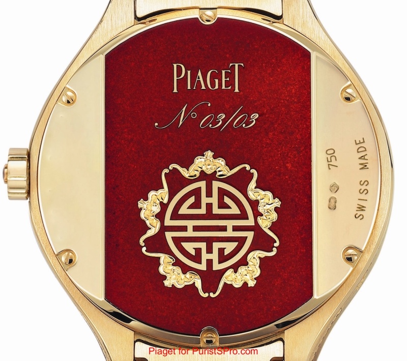 The back features a Chinese motif on a field of red enamel (this photo has been retouched to obscure the watch's serial number).