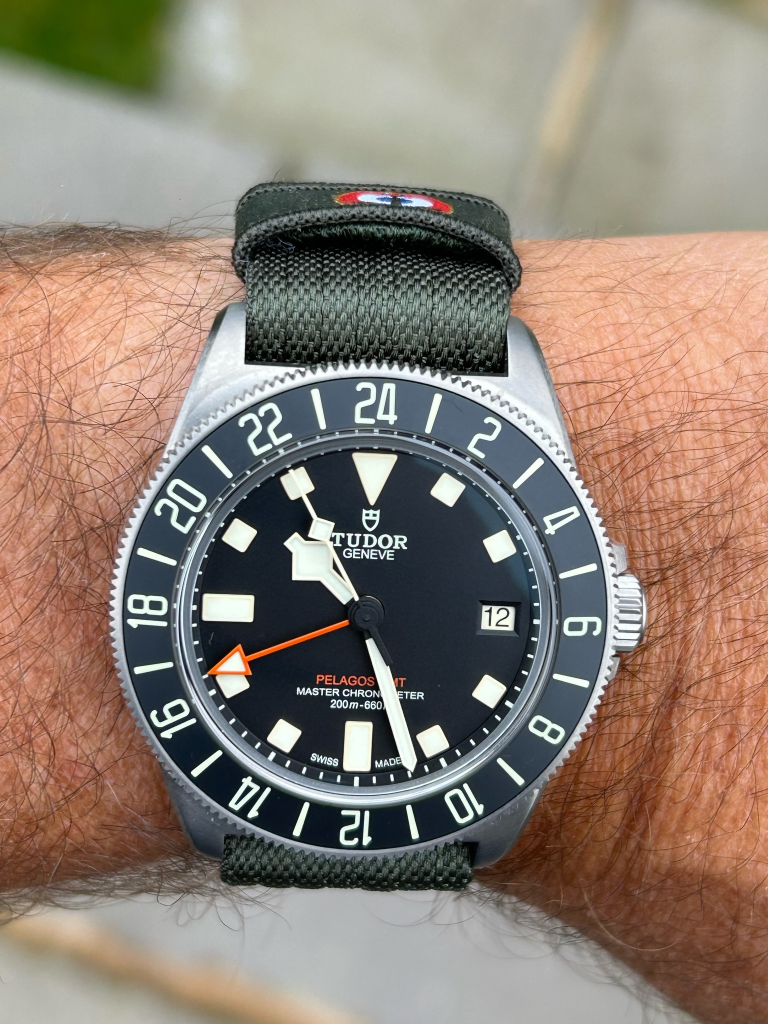 Watch by Rolex, Tudor