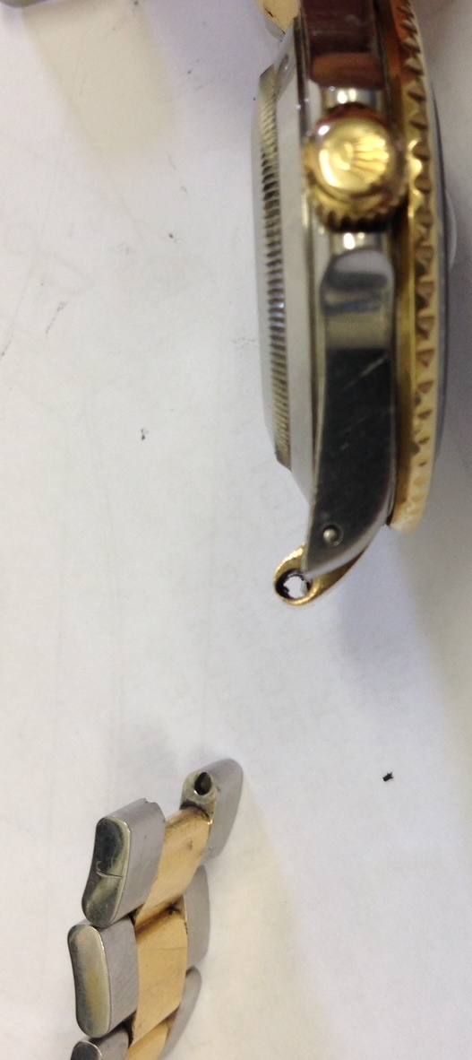 gold and stainless eroded