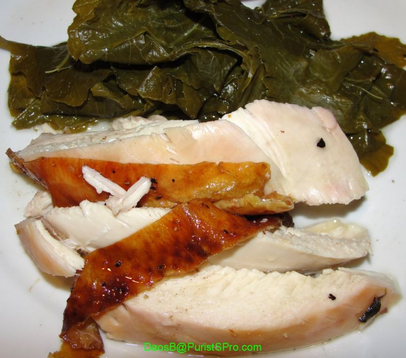 A shot of the whole plate: chicken au jus and slow simmered greens.