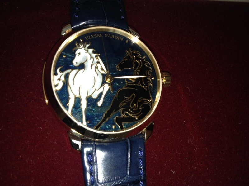 a close-up shot with flash and the white horse 'stands' out more