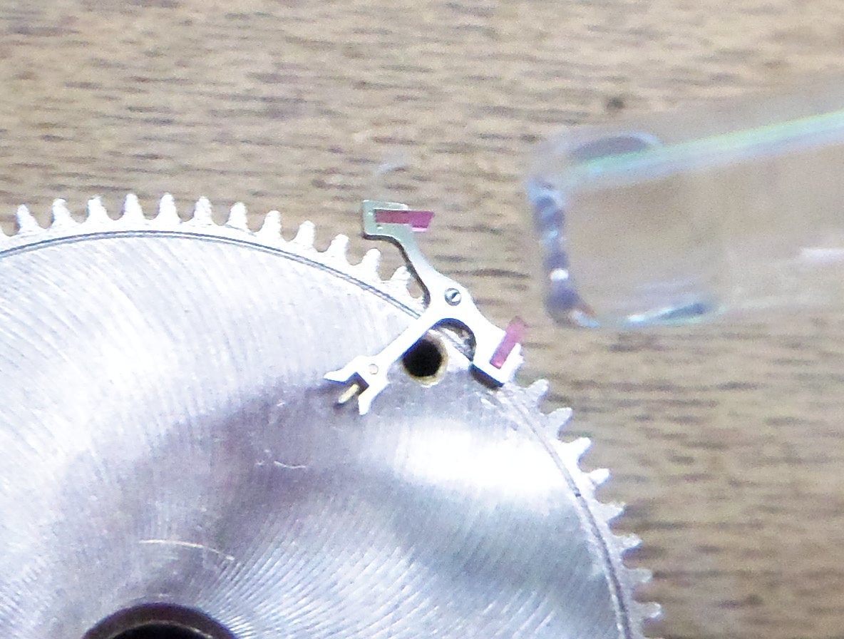 Just touching the tip of jewel into bulge of Epilame.